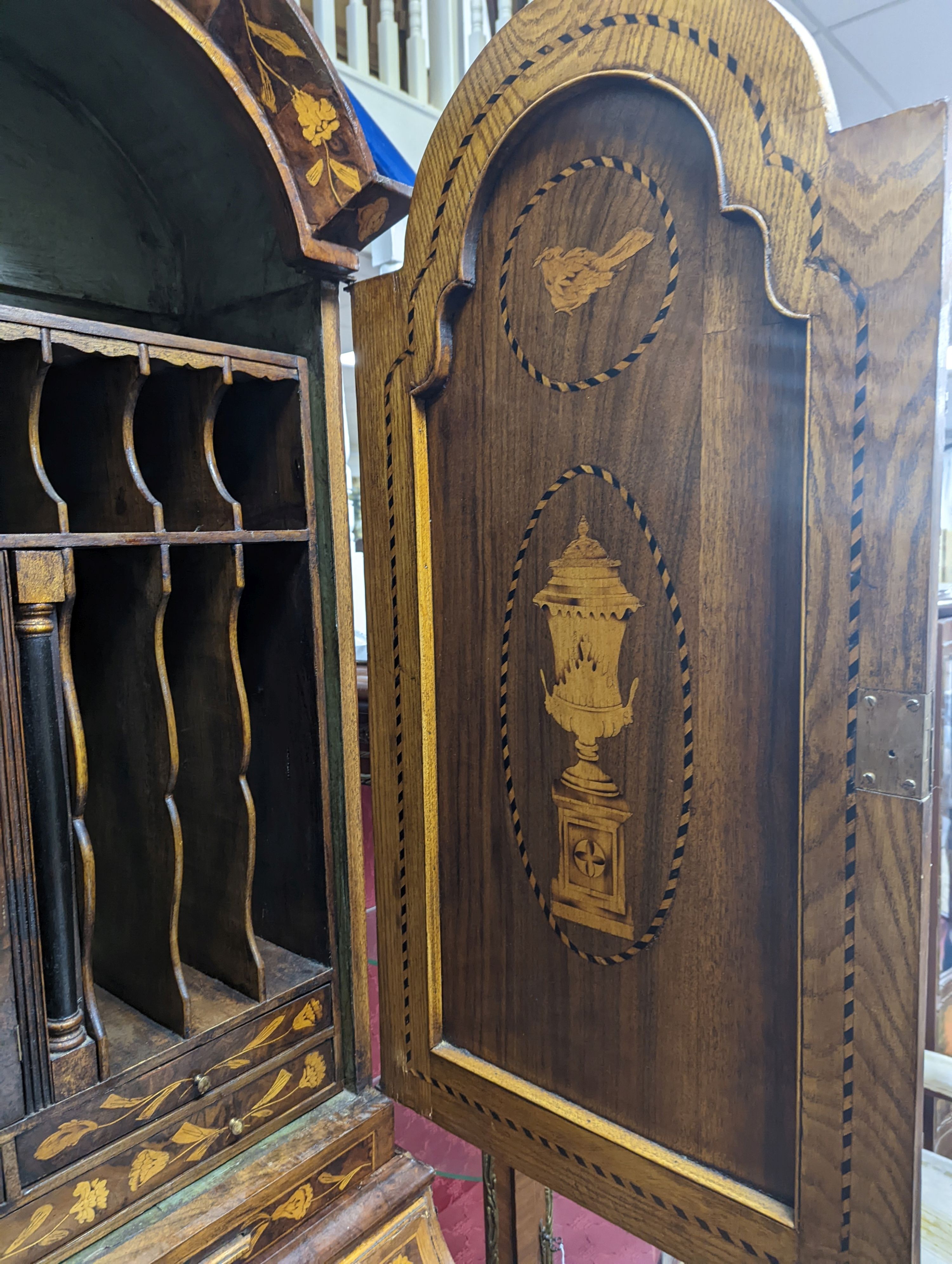 A Dutch floral marquetry walnut bombe bureau cabinet, width 120cm, depth 60cm, height 210cm
